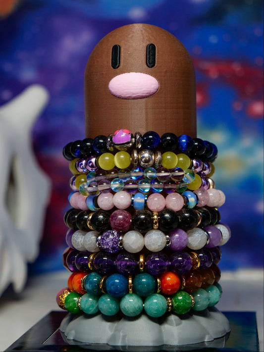 Diglett bracelet holder displaying 12 stacked gemstone bracelets